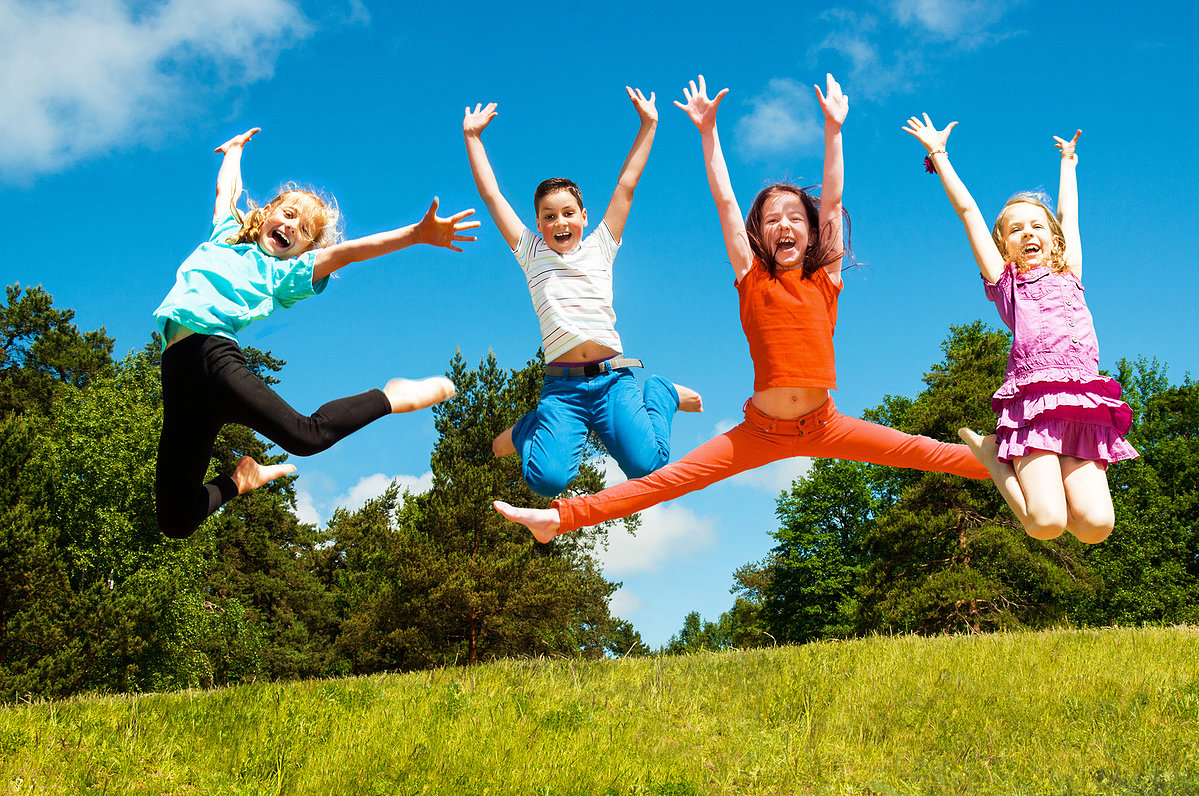 Happy active children jumping Forest Park Preschool and Summer Camp